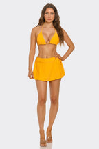 Yellow triangle bikini top and high-rise swim skirt with adjustable waist ties