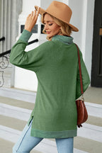 Mock-neck long-sleeve slit tee, light green, relaxed fit with curved hem and side slit.