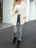 Beige chunky knit cardigan open front with long sleeves and hip-length
