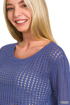 Marlin blue open-knit sweater with round neck and long sleeves, close-up knit texture