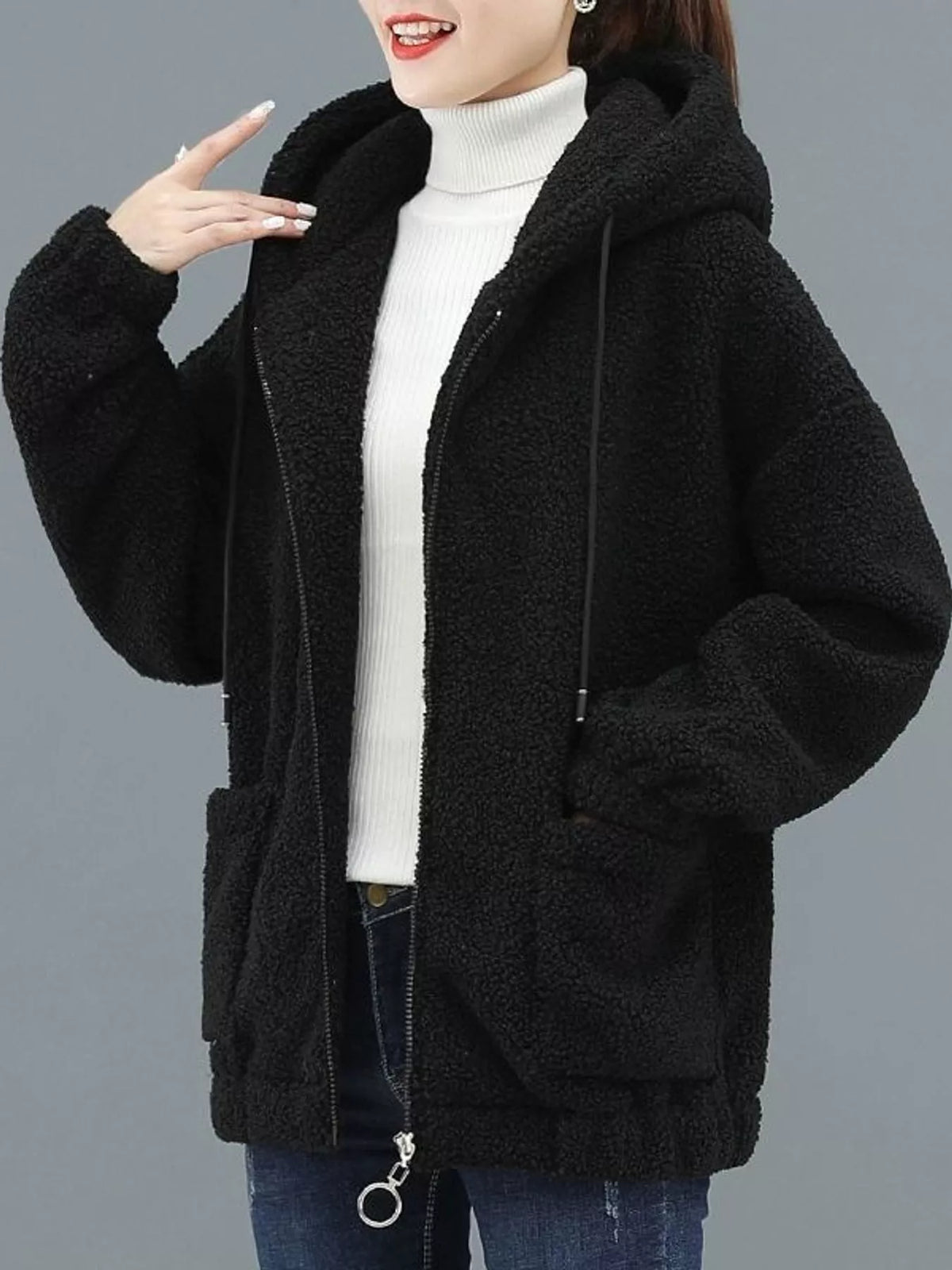 Black fleece zip-up hoodie with hood, front zipper, and two side patch pockets