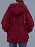 Burgundy fleece zip-up hoodie back view with hood detail and front patch pockets.