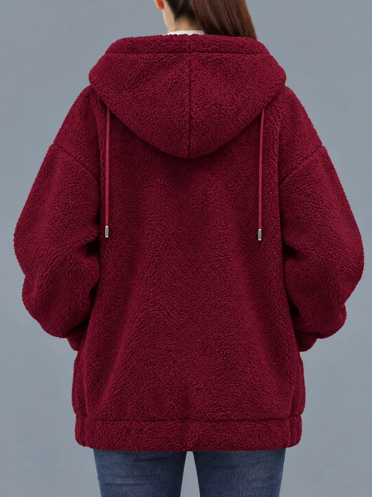 Burgundy fleece zip-up hoodie back view with hood detail and front patch pockets.
