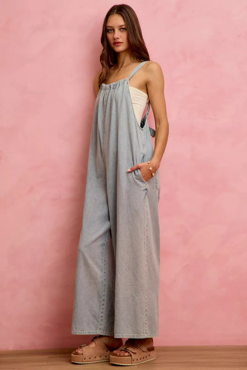 Light denim wide-leg overalls with spaghetti straps and roomy leg opening
