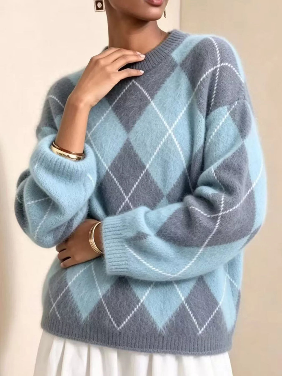 Fuzzy argyle knit sweater in light blue with gray diamond pattern and ribbed cuffs