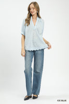 Ice blue pintuck ruffle blouse with V-neck, puff sleeves, and scalloped hem
