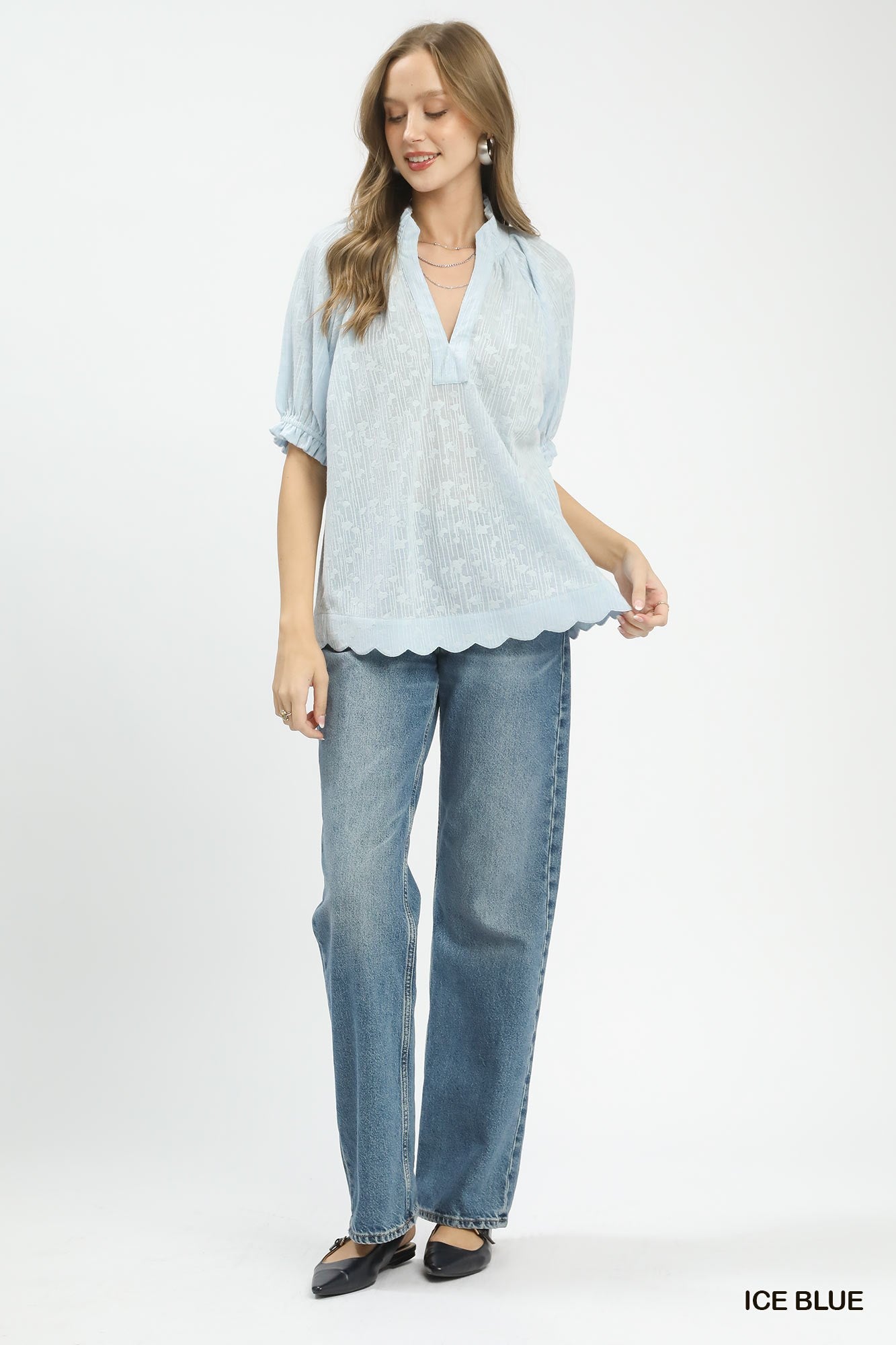 Ice blue pintuck ruffle blouse with V-neck, puff sleeves, and scalloped hem
