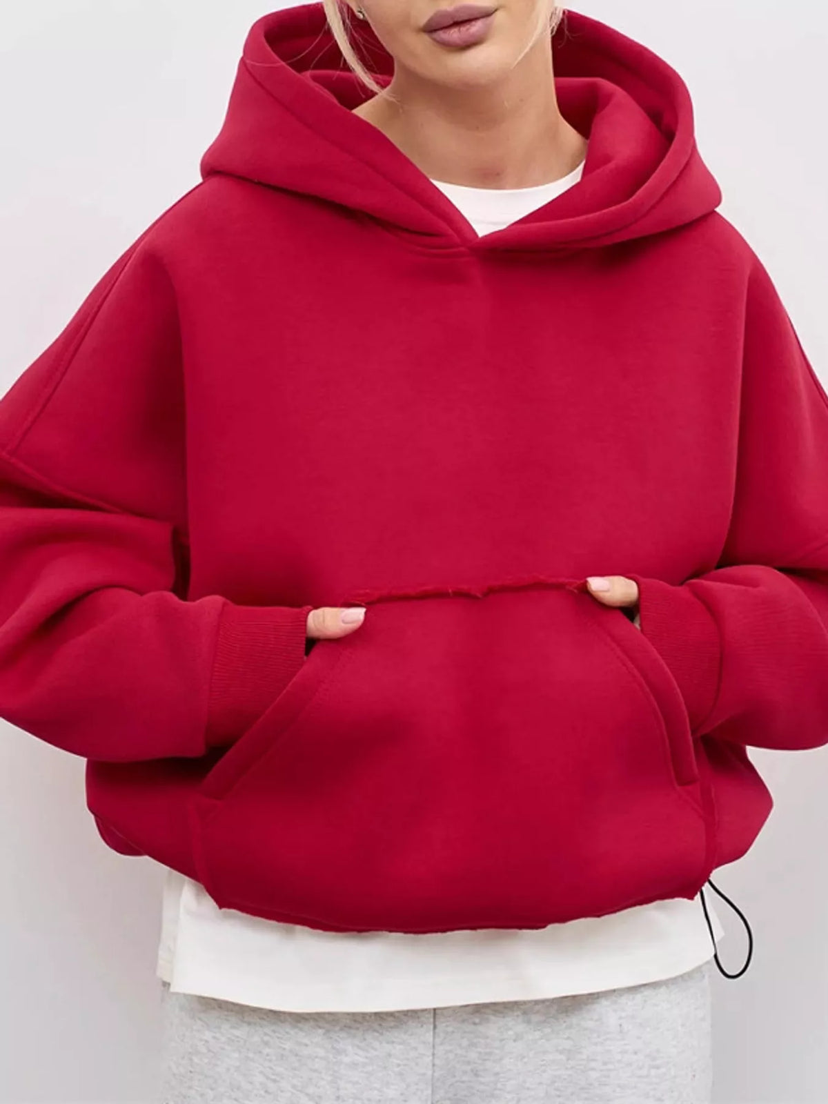 Red oversized kangaroo pocket hoodie with hood and front kangaroo pocket