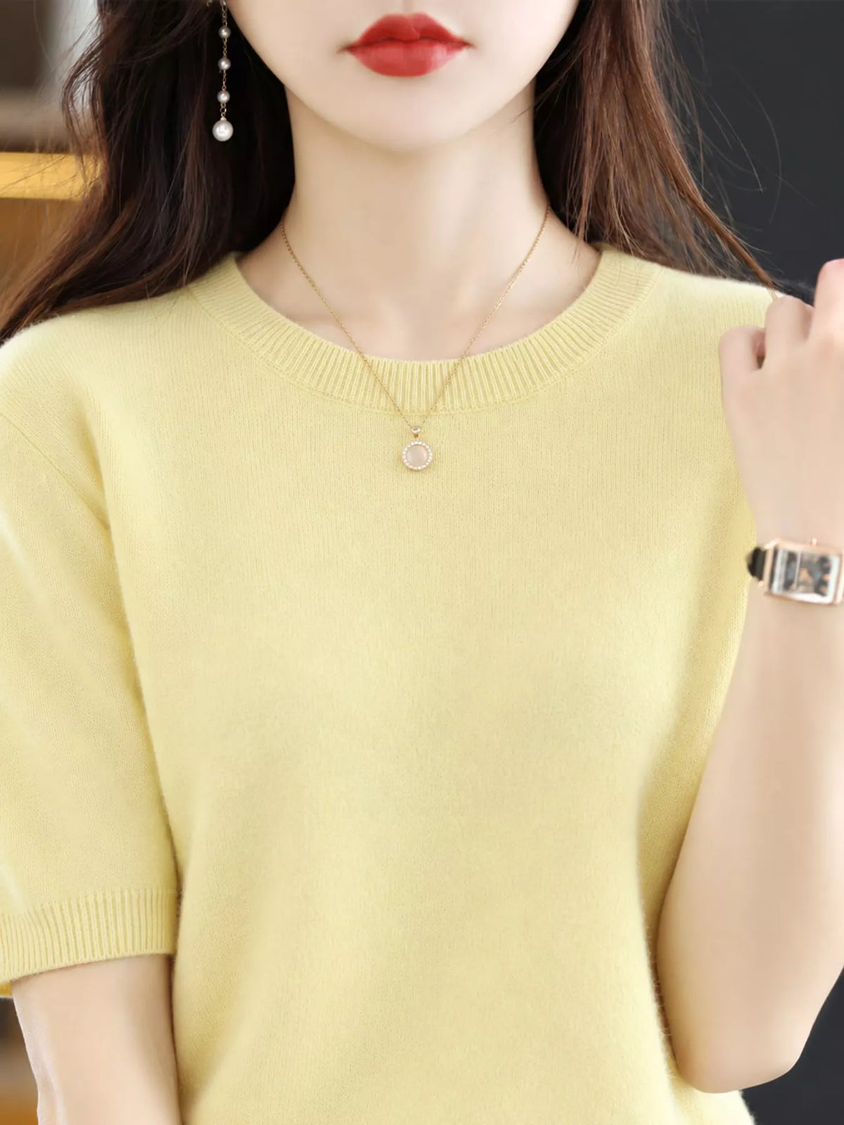 Yellow round-neck short-sleeve knit sweater with ribbed crew collar and cuffs.