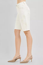 Cream floral-embroidered denim bermuda shorts, side seam embroidery, frayed hem