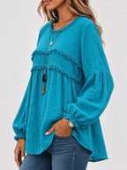 Teal peplum blouse with frayed yoke detail and long balloon sleeves