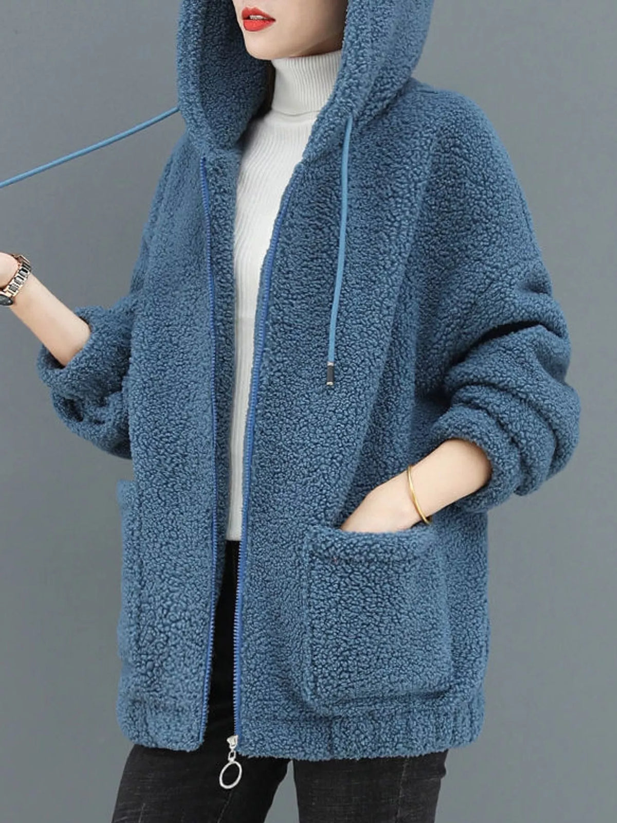 Blue fleece zip-up hoodie with hood, zipper front, and side pocket