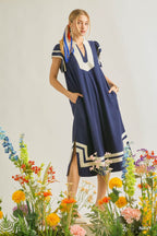 Navy linen-cotton midi dress with V-neck, short sleeves, and white geometric border