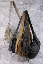 Set of crescent shoulder bags in beige and black, each with zip pocket and side ties
