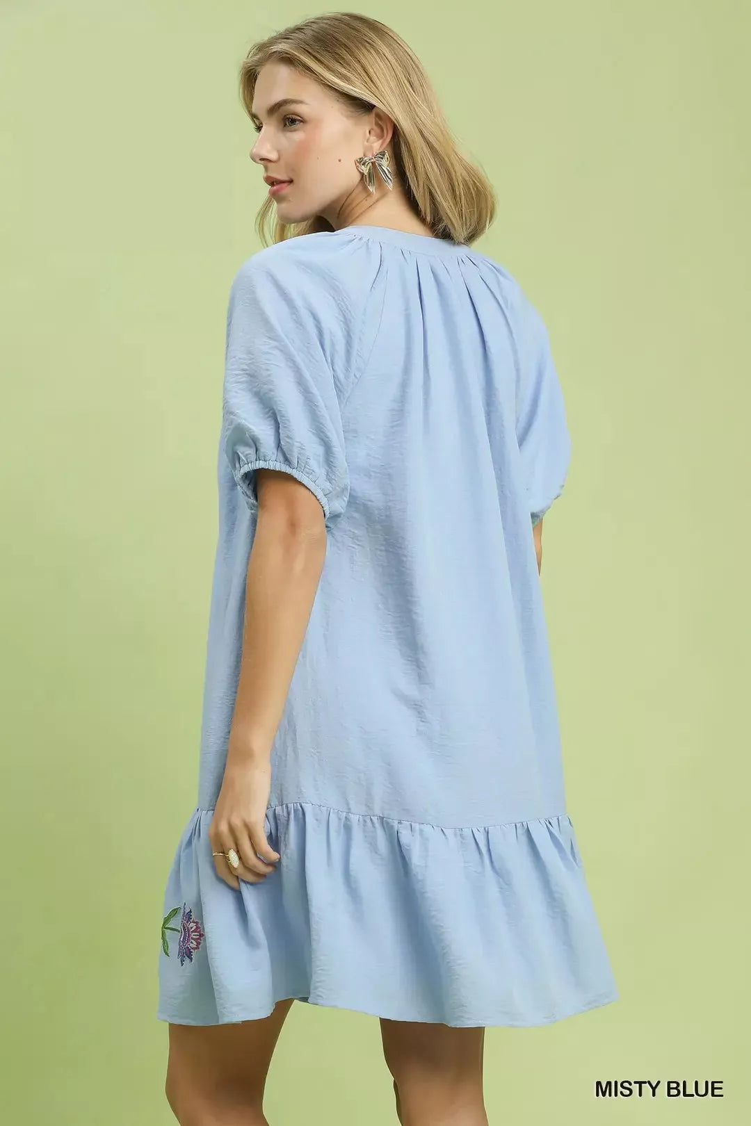 Light blue babydoll dress with puff sleeves and tiered back hem