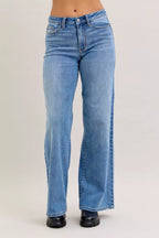 Light blue mid-rise wide-leg jeans with belt loops and buttoned front
