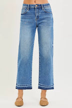 Medium blue cropped jeans with cuffed hem, belt loops, button fly