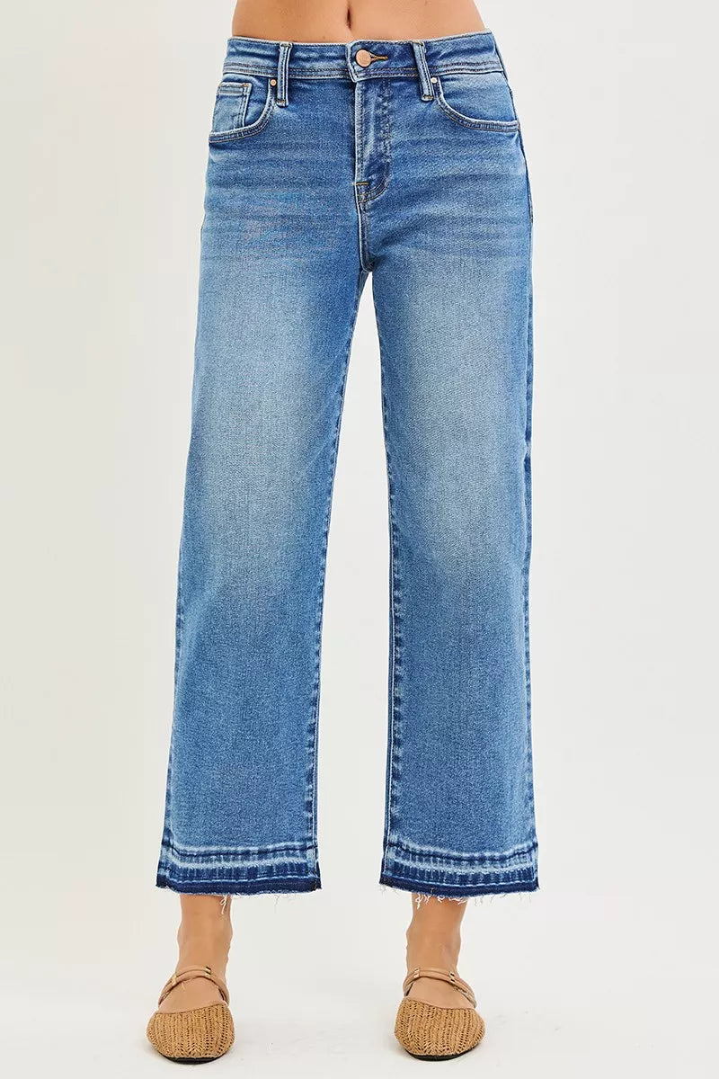 Medium blue cropped jeans with cuffed hem, belt loops, button fly