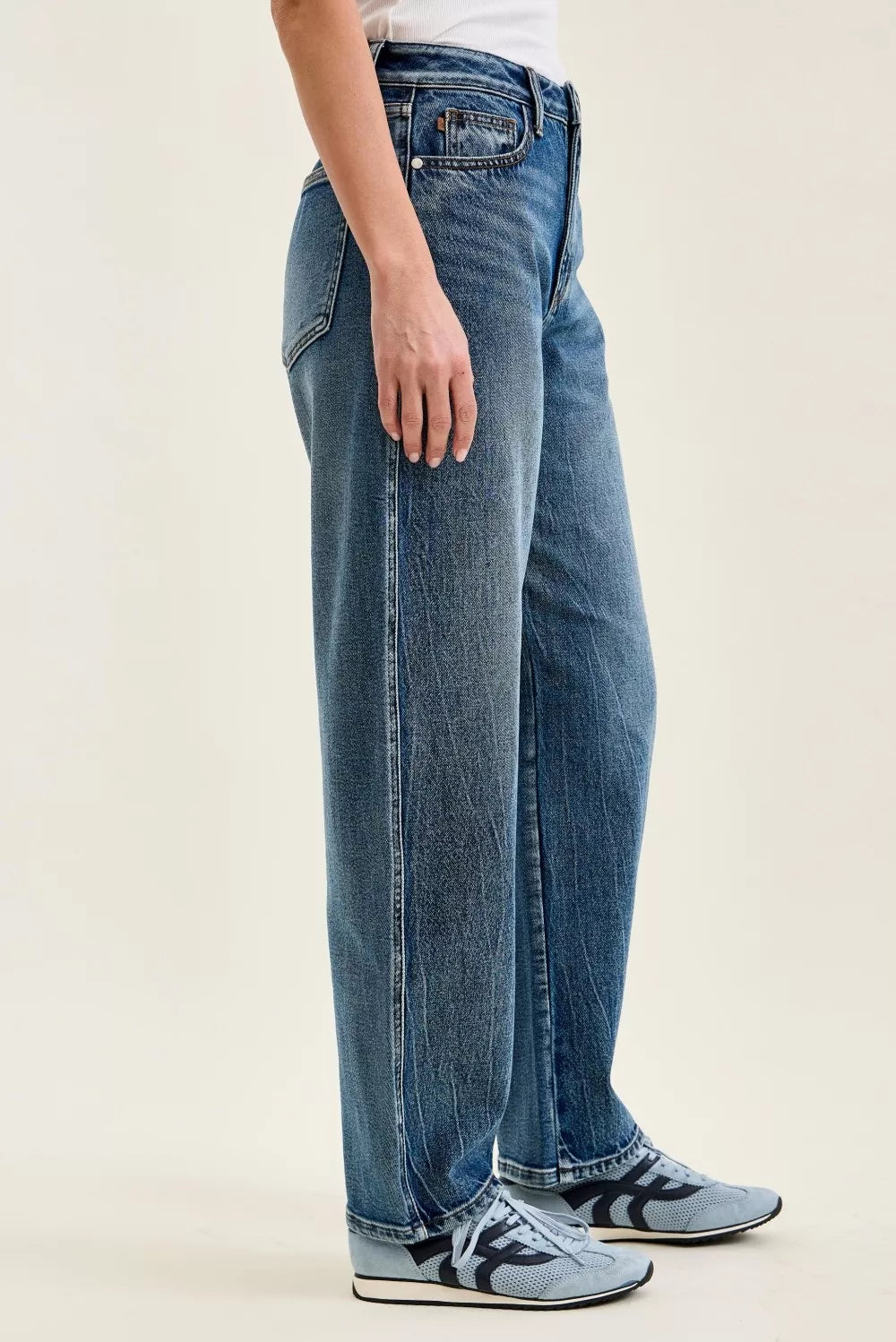 Petite wide-leg indigo wash jeans, side view with stacked hems and belt loops