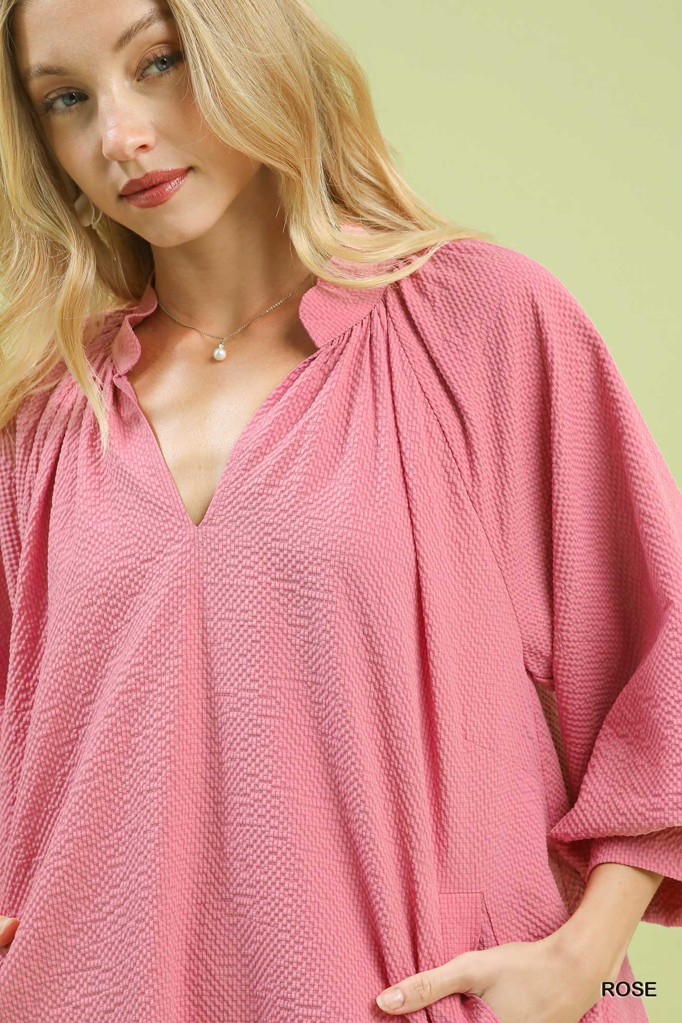 Rose pink textured V-neck mini dress with gathered neckline detail and balloon sleeve cuff