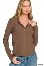 Brown double-knit snap-button shirt with button placket and long sleeves