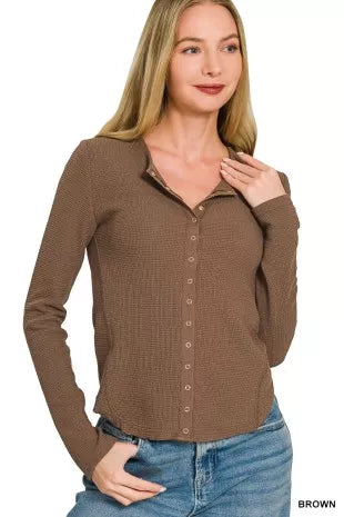 Brown double-knit snap-button shirt with button placket and long sleeves