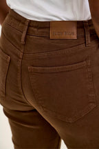 Mahogany wash jeans with "JUDY BLUE" logo label on the waistband