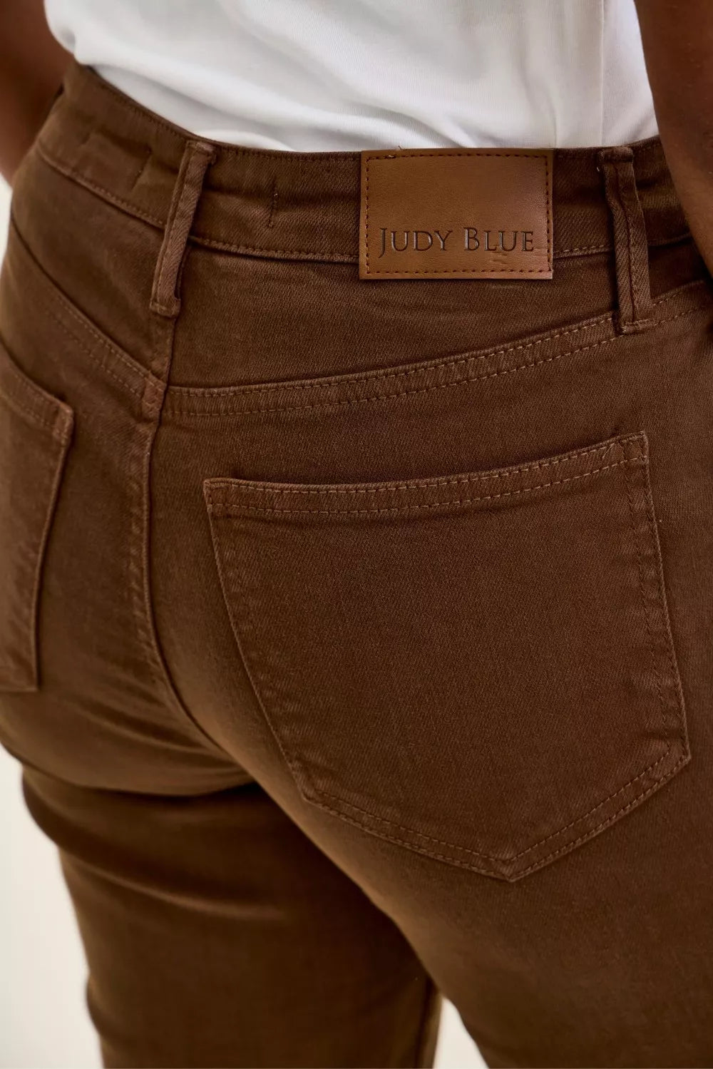 Mahogany wash jeans with "JUDY BLUE" logo label on the waistband