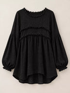 Black frayed trim peplum blouse front view with tiered ruffle bands and puff sleeves