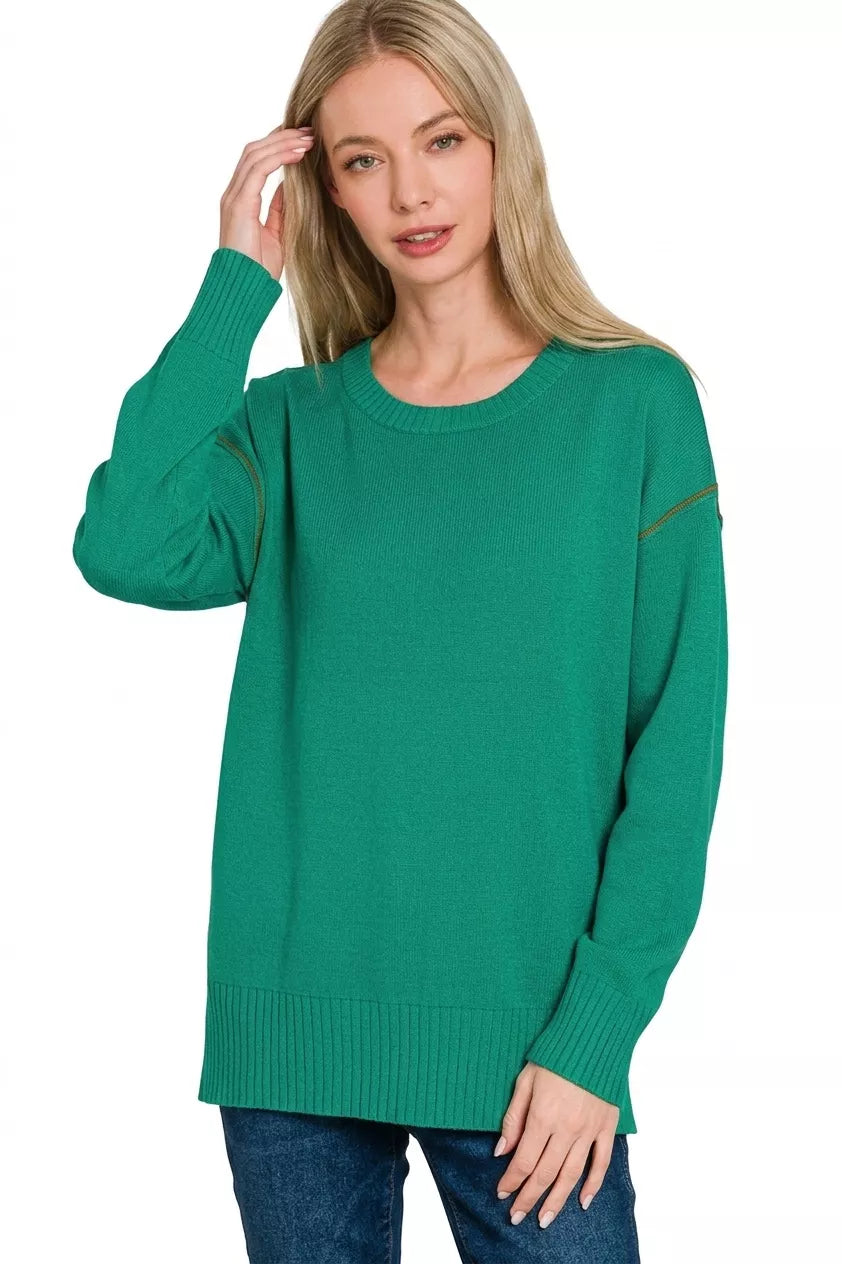 Forest green round-neck knit top with contrast sleeve trim, long sleeves