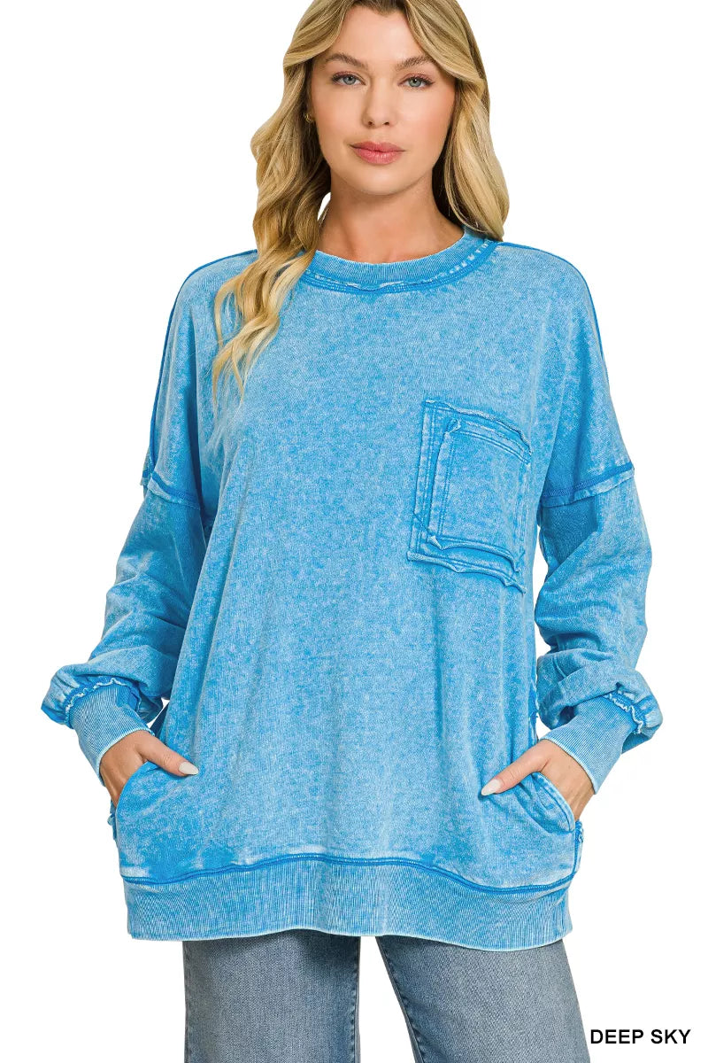 Women's blue acid-wash sweatshirt with crew neck, long sleeves, and front pocket