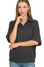 Black polo collar short-sleeve pullover with front placket and straight hem