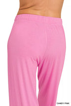 Pink loungewear pants set with elastic waistband and draped wide legs