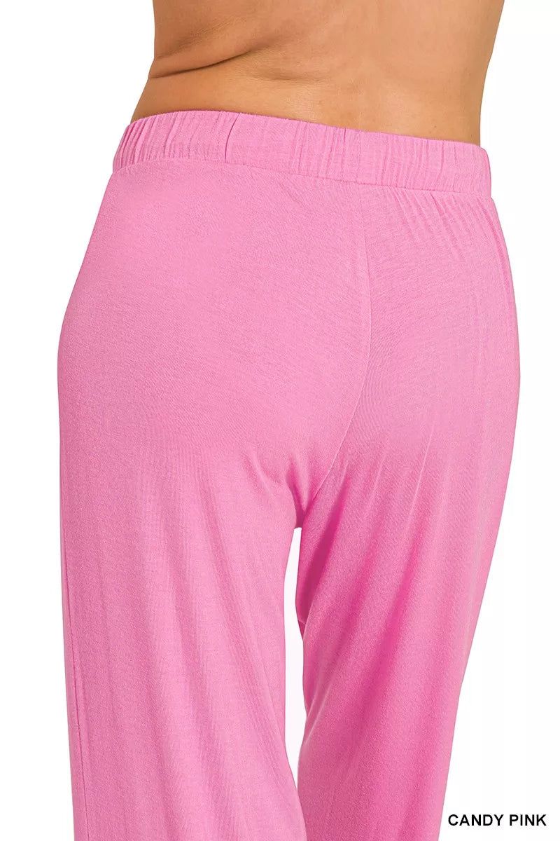 Pink loungewear pants set with elastic waistband and draped wide legs