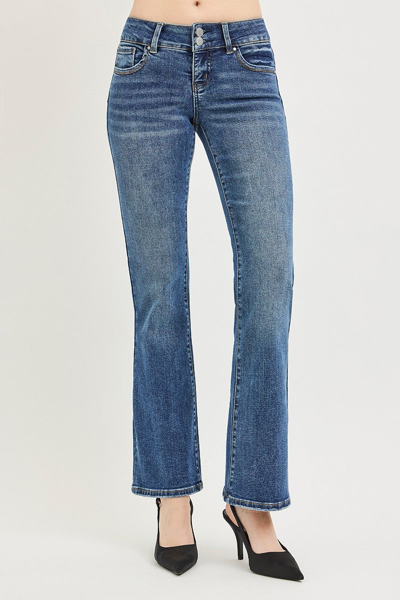 Medium wash low rise bootcut jeans with front seam details and flared cuffed hem