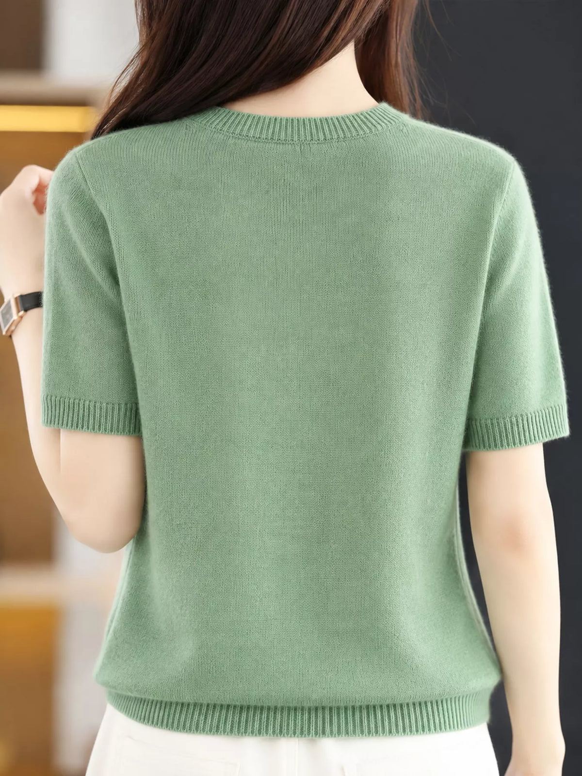 Back view of a sea-green round-neck short-sleeve sweater
