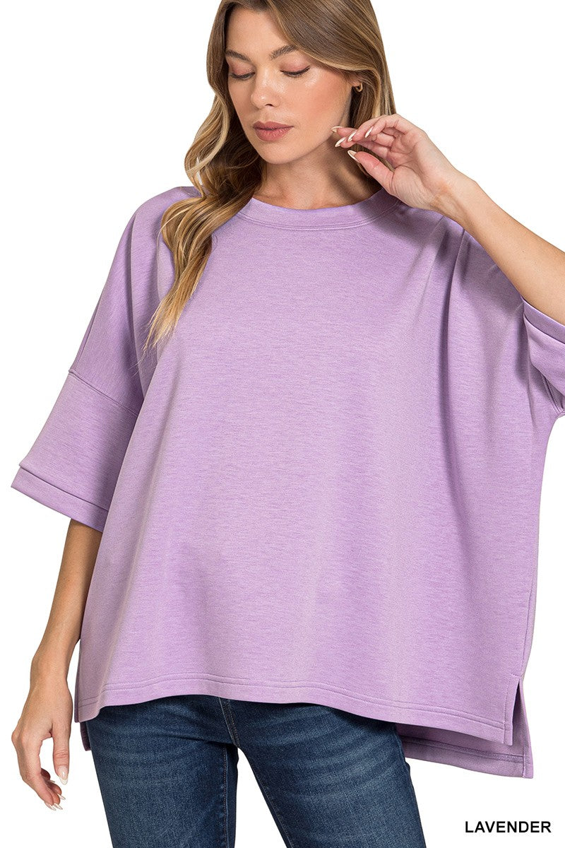 Lavender scuba round-neck top with relaxed drape and short sleeves