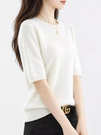 White short-sleeve round-neck knit sweater with ribbed neckline and cuffs