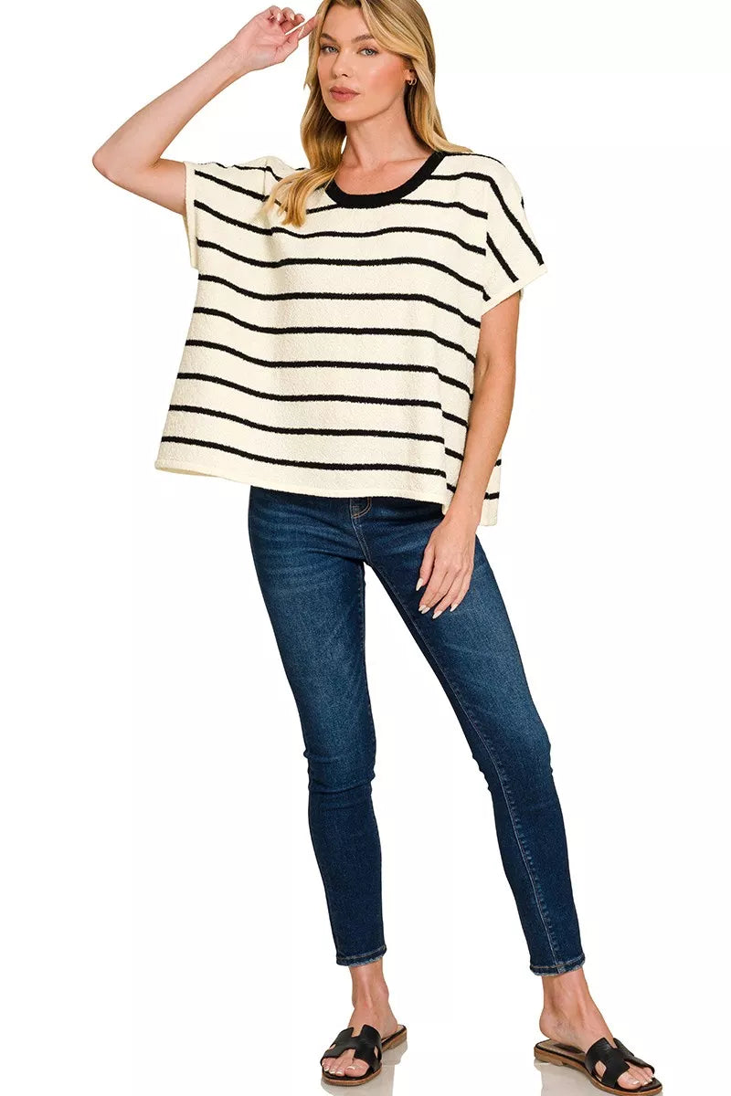 Striped oversize sweater top with crew neck and short sleeves, black and cream horizontal stripes