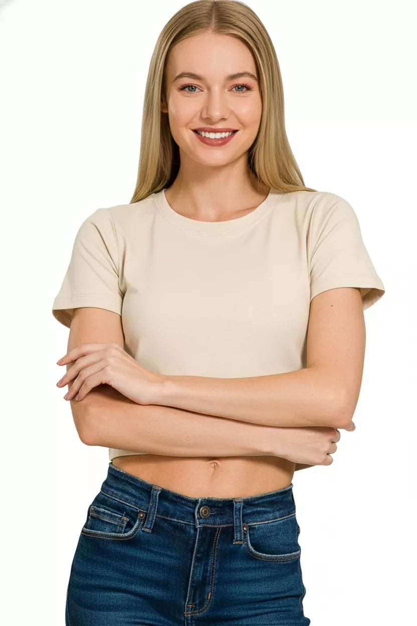 Sand beige cropped top with short sleeves and round neck, relaxed fit