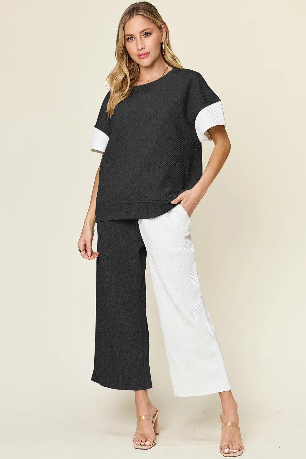 Contrast T-shirt and wide-leg pants set: black top with white sleeves, white wide-leg