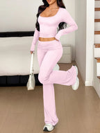 Pink long-sleeve crop top and bootcut pants set, square scoop neckline.