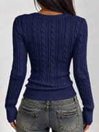 Navy cable-knit sweater back view with vertical cable texture and long sleeves