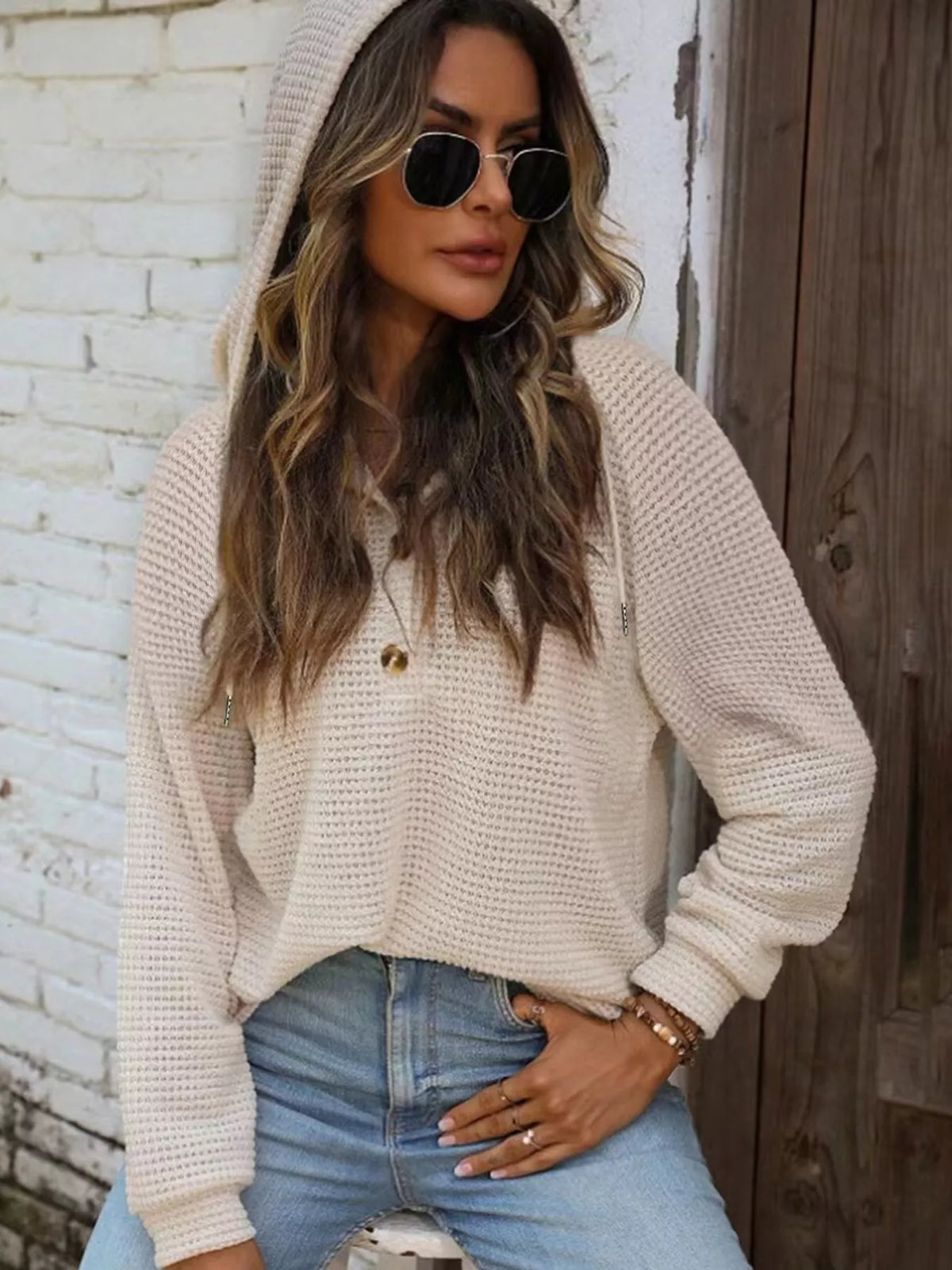 Cream waffle-knit button hoodie with hood, long sleeves, and front button placket