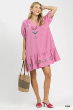 Pink embroidered babydoll dress with puff sleeves and round neckline ruffle