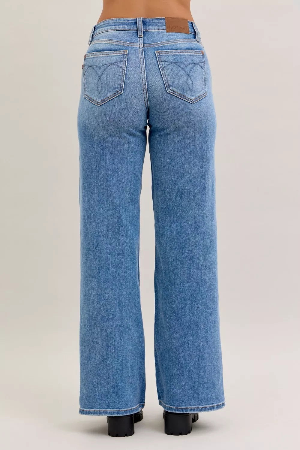 Light blue mid-rise wide-leg jeans with two back patch pockets and belt loops