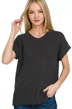Black ribbed knit top with center seam, crew neckline and short sleeves