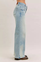 Light blue high-waist straight jeans back view with yoke, belt loops, and patch pockets