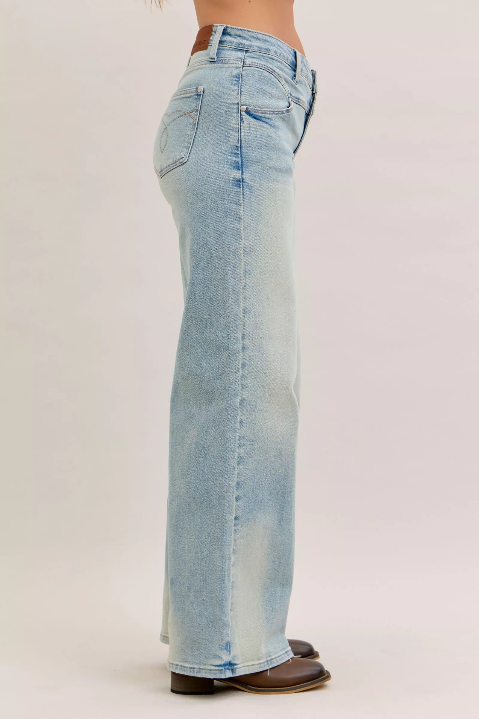 Light blue high-waist straight jeans back view with yoke, belt loops, and patch pockets