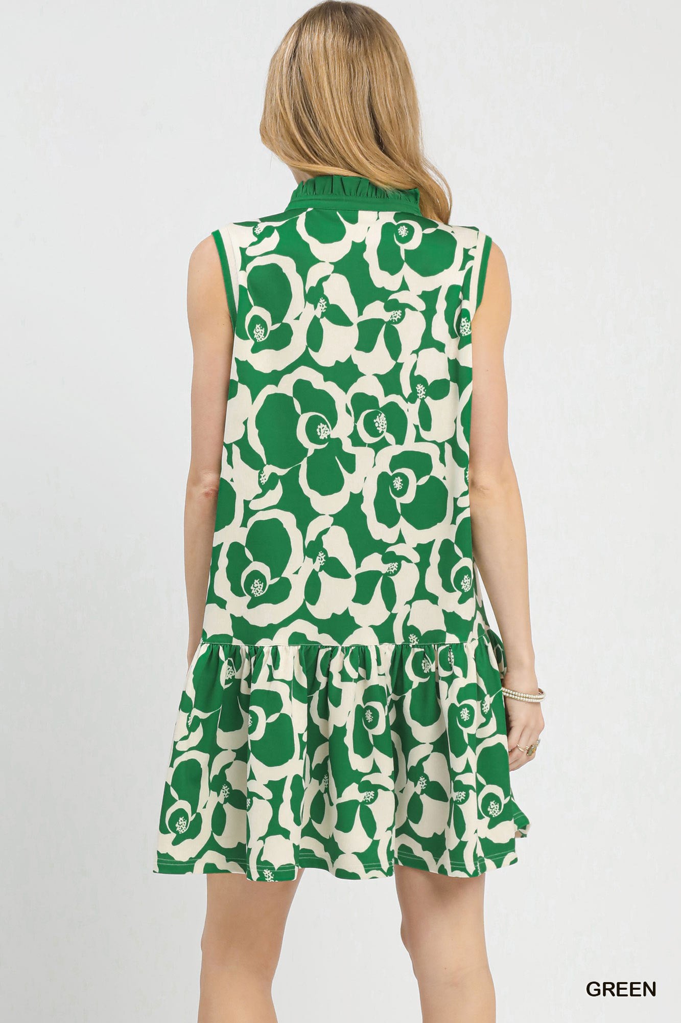 Green sleeveless V-neck tiered mini dress with white floral print, back view